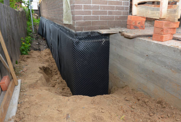 Happy homeowners after waterproofing job in Semmes